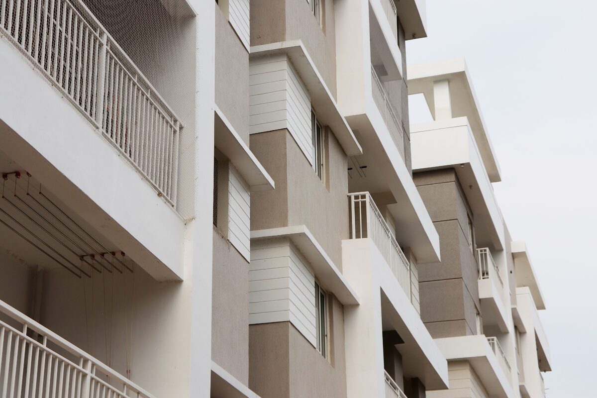 Low angle view of modern apartment buildings in Hyderabad, showcasing urban architecture and exterior design.