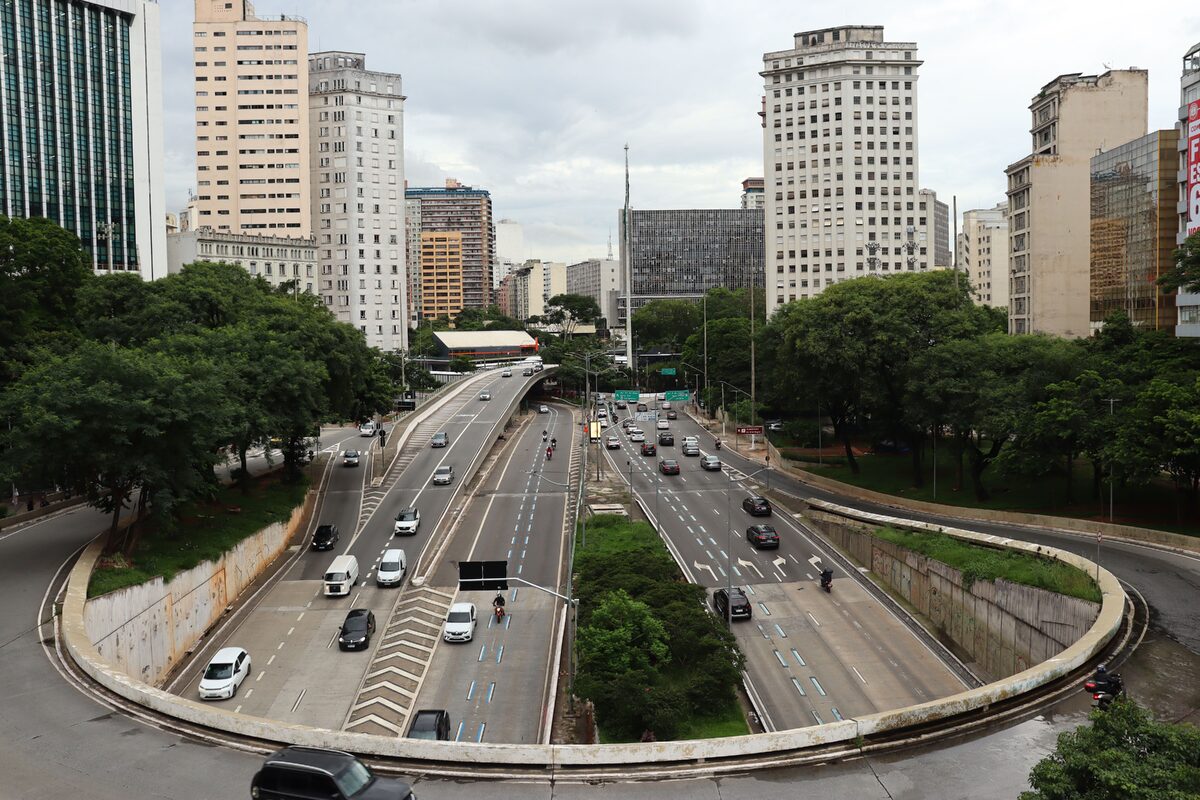 A dynamic view of Sao Paulo's urban landscape featuring busy highways and skyscrapers.
