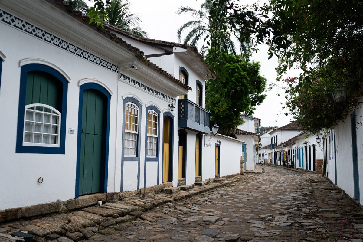 Picturesque view of a cobblestone street with colonial architecture in Paraty, Brazil.