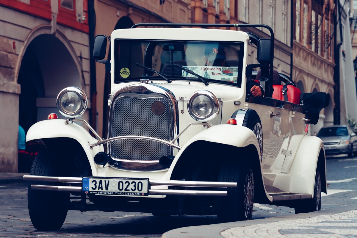 Elegant vintage car on a cobblestone street, capturing timeless charm.